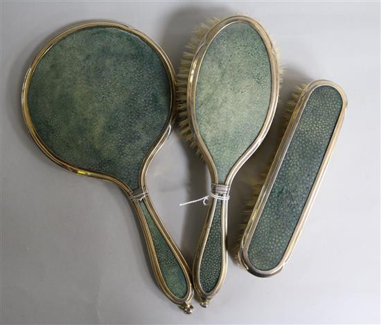 A George V silver and shagreen mounted three piece mirror and brush set by Charles & Richard Comyns, London, 1926.